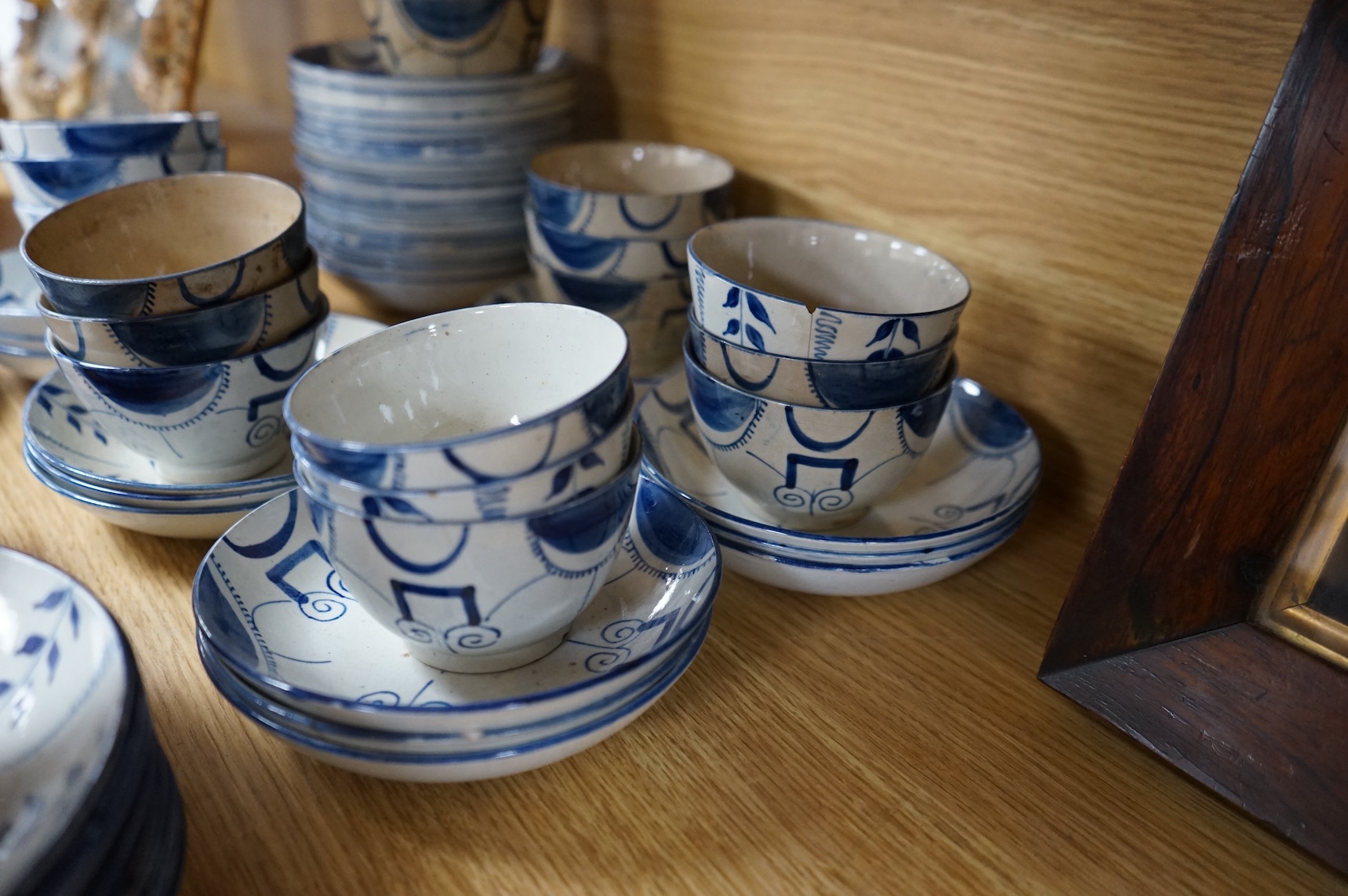 A group of 19th century pearlware set of tea bowls and saucers and to similar basket with border plates
